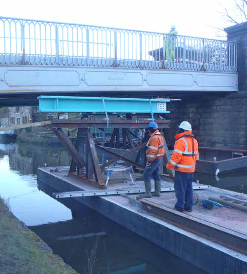 Flat-top WHH pontoon beneath a bridge structure