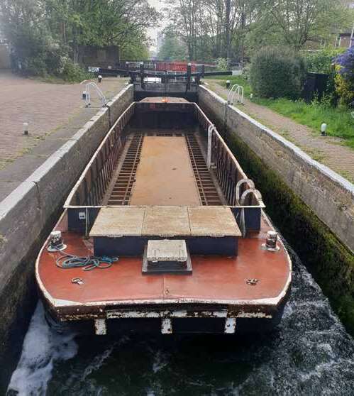Large open WHH general-purpose barge on a canal