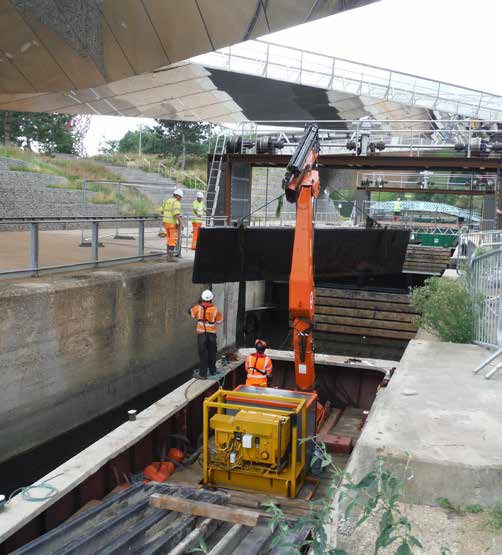Heavy WHH crane barge operating inside a lock