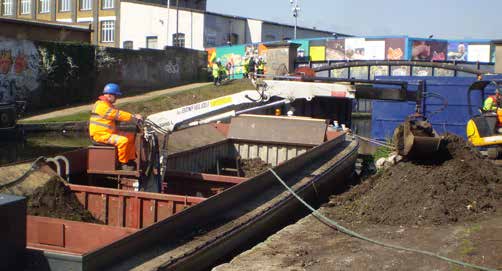 Self-propelled WHH motor HIAB barge carrying materials