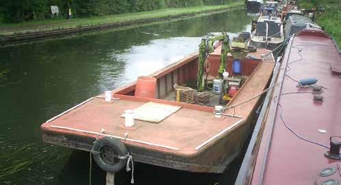 Compact WHH HIAB barge viewed from the towpath