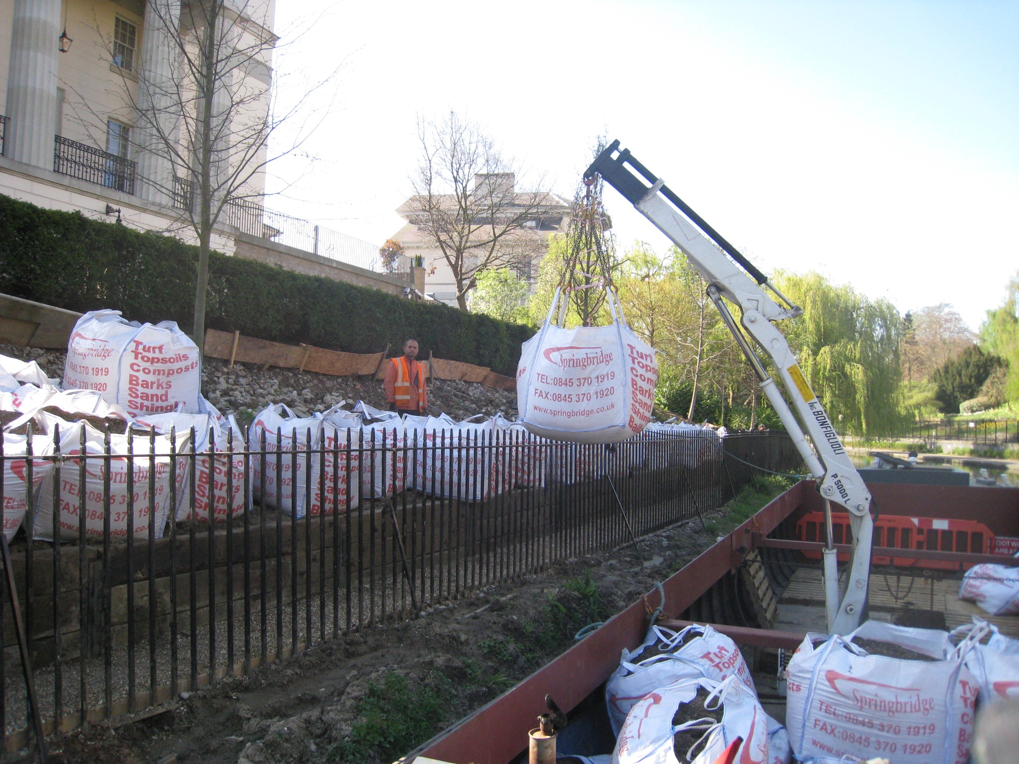 WHH crane boat lifting one-tonne bulk bags of topsoil into Regent's Park