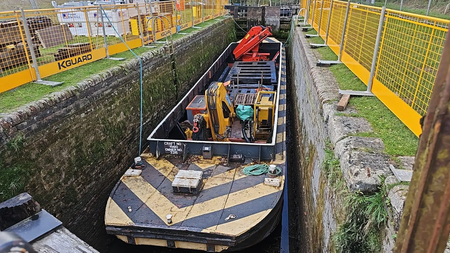 Twin-crane barge Jumbo grounded inside the drained lock chamber