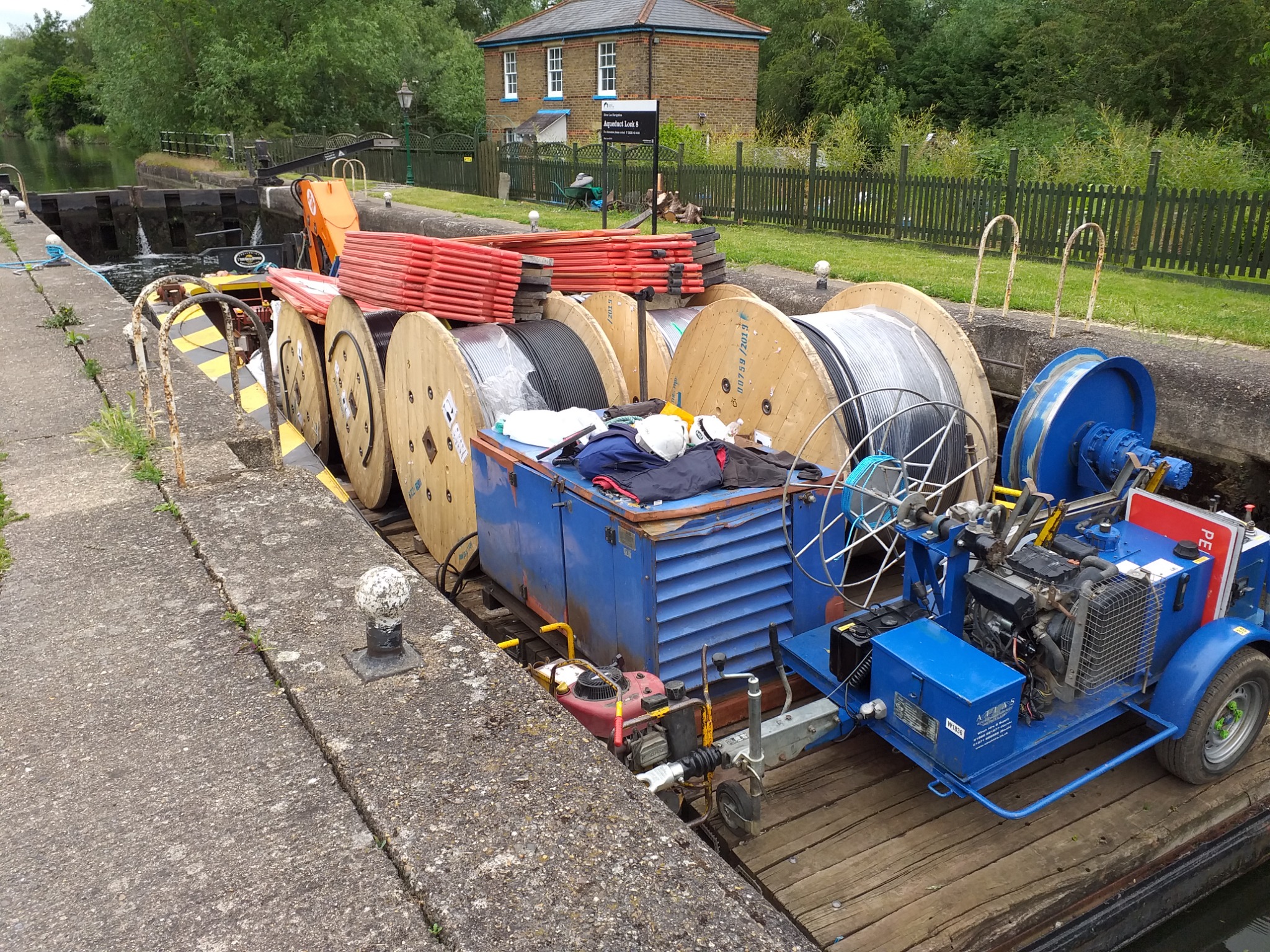 WHH workboats Buttercup and Dudley carrying cable reels and equipment through Aqueduct Lock on the River Lee