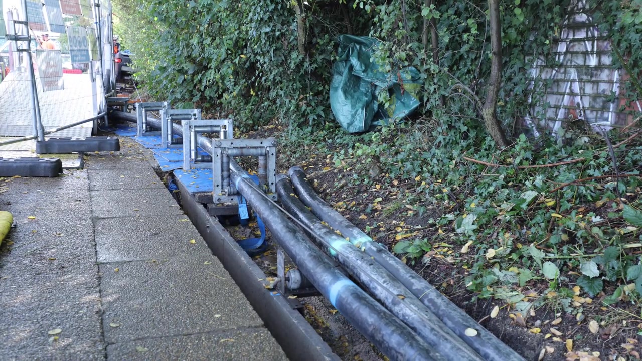 Installed cable bundles running along the towpath route